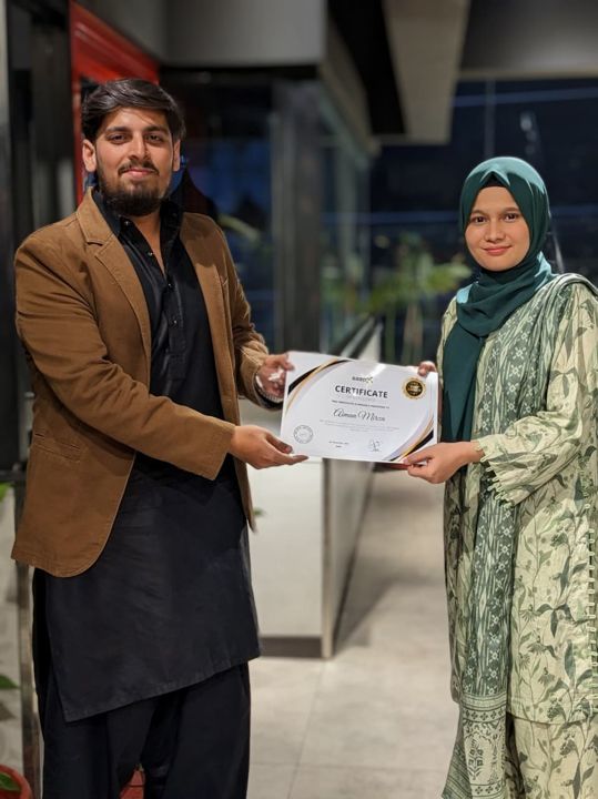 A Saapx team member receiving the Best Performer Award certificate
